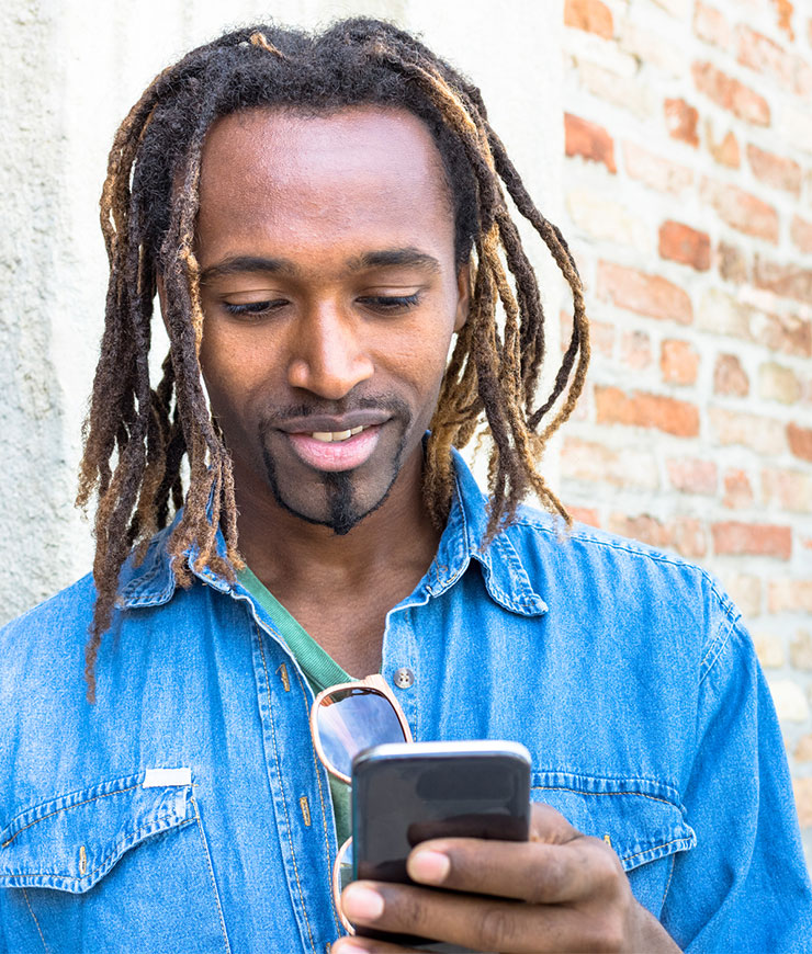 rasta man holding phone